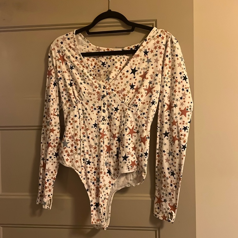 Super fun star patterned free people bodysuit!